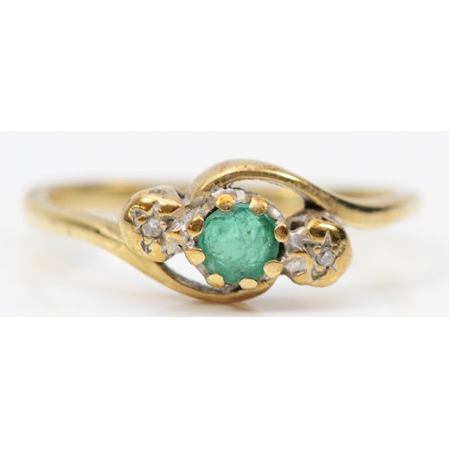 99 - A 9ct gold emerald and diamond three stone ring, P, 2g