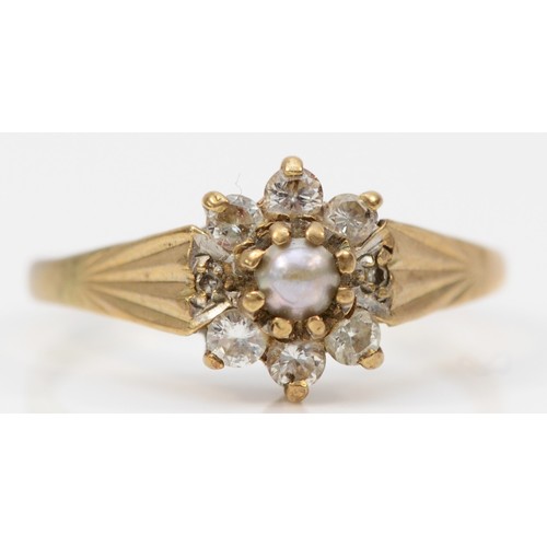 101 - A 9ct gold seed pearl and diamond cluster ring, claw set, L, 1.7g