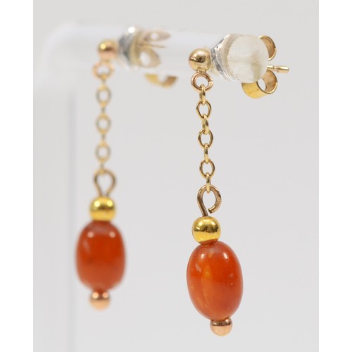 103 - A pair of 9ct gold amber drop earrings with scroll backs, 30mm drop, 1.1g