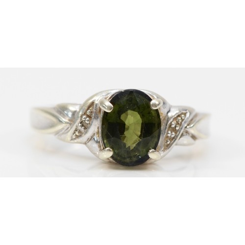 104 - A 9ct gold oval cut tourmaline and diamond ring, N, 4.2g