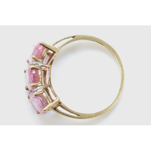 107 - A 9ct gold oval cut pink topaz and diamond ring, P, 2.9g