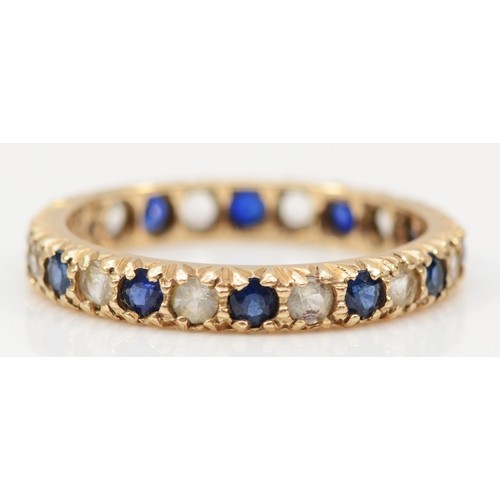 124 - A 9ct gold sapphire and white stone eternity ring, M 1/2, 1.9g