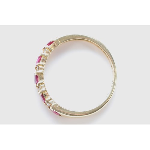 125 - A 9ct gold ruby and diamond half eternity ring, K 1/2, 2.1g