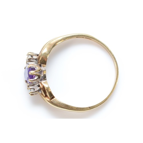 127 - A 9ct gold three stone amethyst and diamond three stone ring, S 1/2, 2.3g