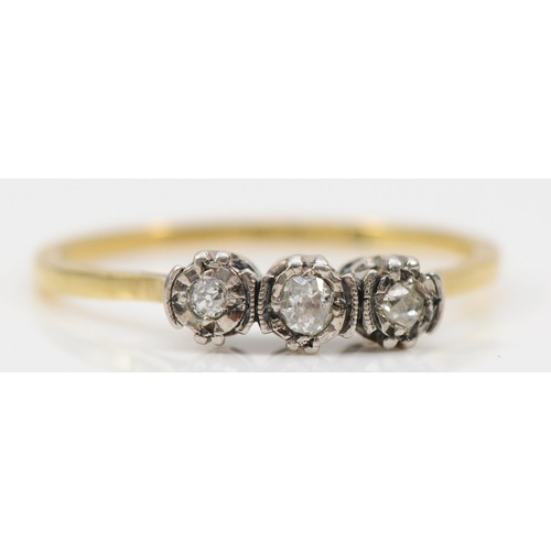 135 - An 18ct gold and platinum three stone diamond ring, U, 2.7g