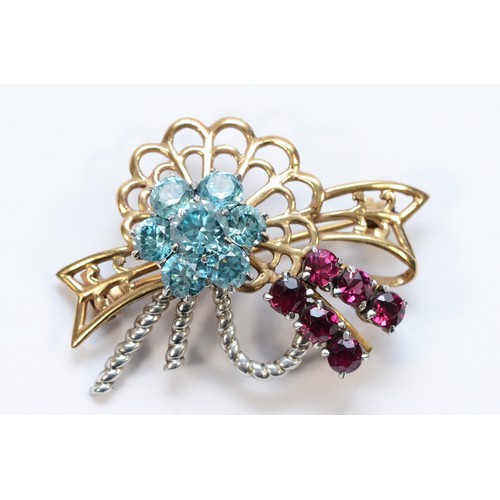 136 - Garrard & Co. Ltd., a 9ct two colour gold, blue zircon and garnet brooch, S & L Ltd for Garrard, Bir... 