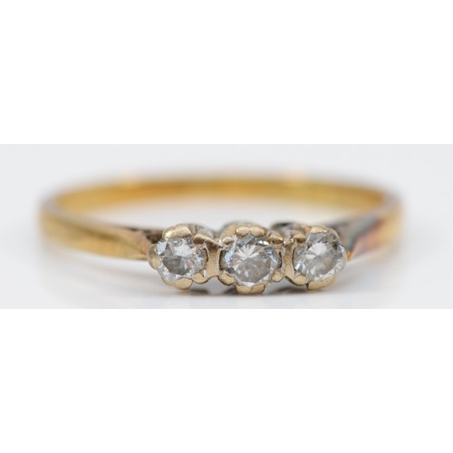 137 - An 18ct gold diamond three stone ring, P 1/2, 2.7g