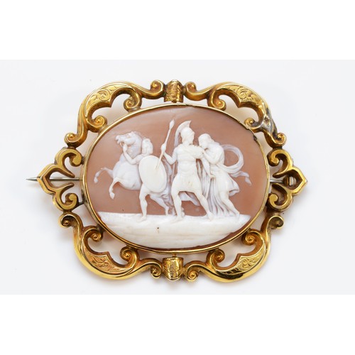 138 - A Victorian gold mounted shell cameo brooch, carved to depict a Roman centurion with a women, shell ... 