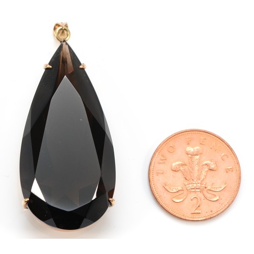 155 - A 9ct gold mounted pear shape smokey quartz pendant, stone 52 x 26mm, 25.9gm