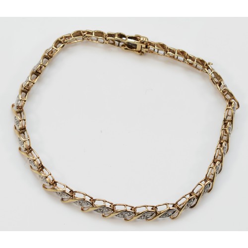 160 - A 9ct gold and diamond set line bracelet, 19cm, 8.2gm