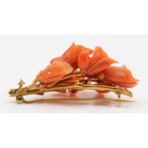 169 - An early 19th century Neapolitan coral and high carat gold brooch, c.1830/40, mounted with carved fl... 