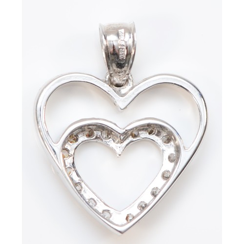 187 - An 18ct white gold and diamond heart pendant, 16mm length, 2.5g