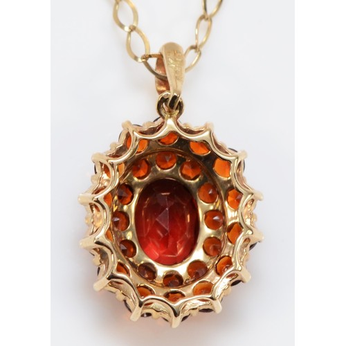 196 - A 9ct gold and garnet cluster pendant, 15 x 14mm, chain, 2.7gm