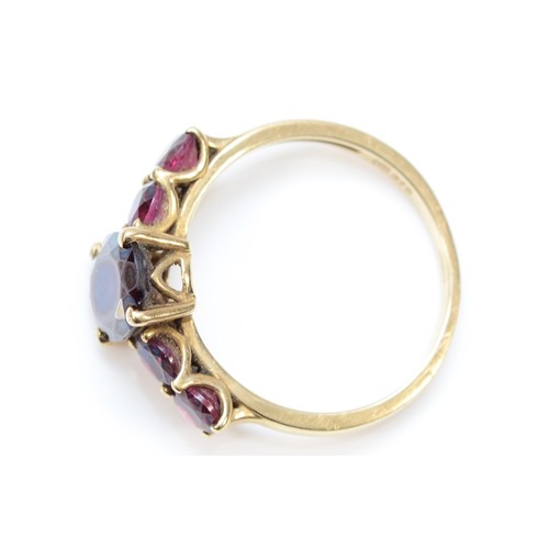 206 - A 9ct gold and five stone garnet ring, central stone10 x 7mm, P, 2.6gm