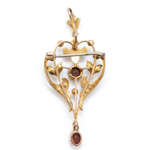 211 - An Edwardian 9ct gold garnet and half pearl openwork brooch/pendant, 52mm, 9ct stamp, 3.7gm