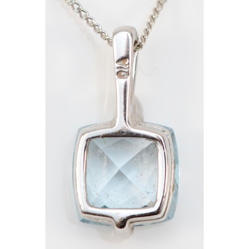 228 - A 9ct white gold, blue topaz and diamond pendant, stone 8 x 8mm, chain, 2.1gm