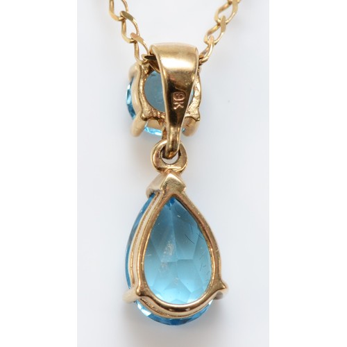 245 - A 9ct gold and blue topaz pendant, 17nn, chain