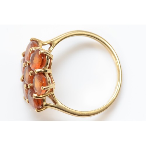 264 - A 9ct gold orange garnet cluster ring, 16mm, N 1/2, 3.2gm