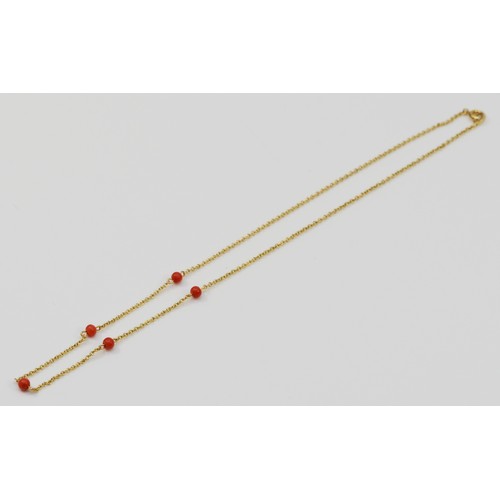 278 - A 9ct gold and 3mm 42cm, 2.5gmcoral bead necklace,