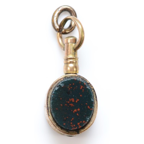 280 - An Edwardian gold cased swivel fob, set with bloodstone and cornelian, stone 9 x 7mm.