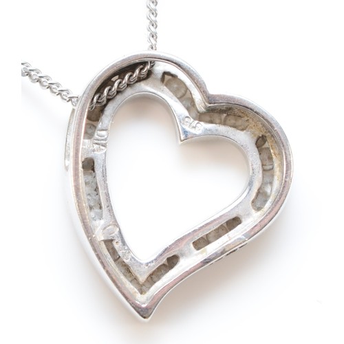 292 - A 9ct white gold and brilliant cut diamond heart pendant, stated weight 0.25cts, chain, 3.2gm