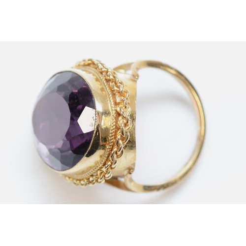 320 - A vintage 9ct gold and large amethyst dress ring, 19 x 14mm, rope twist border, K 1/2, 7.3gm