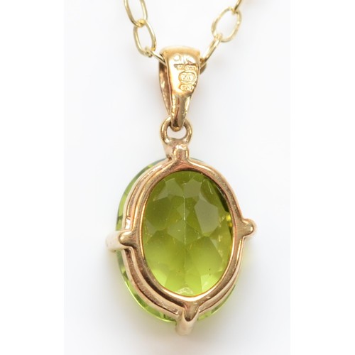 342 - A 9ct gold oval peridot single stone pendant with necklace, 10mm pendant, 1.7g