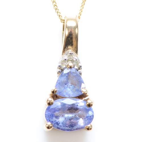 346 - A 9ct gold diamond and tanzanite pendant, with necklace, pendant is 15mm, 2.3g