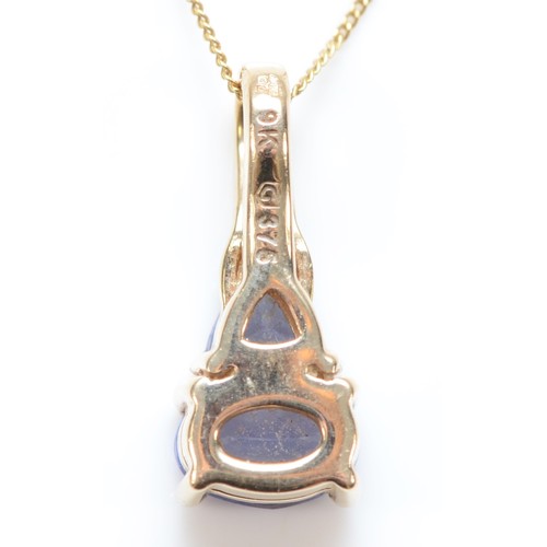 346 - A 9ct gold diamond and tanzanite pendant, with necklace, pendant is 15mm, 2.3g