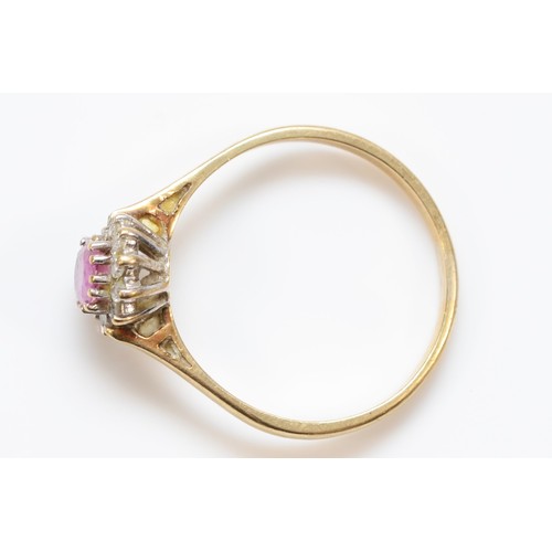 352 - A 9ct gold diamond and pink sapphire oval cluster ring, P 1/2, 1.8g