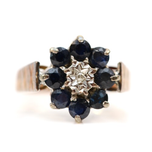 353 - A 9ct gold vintage diamond and sapphire floral cluster ring, N, 4.2g