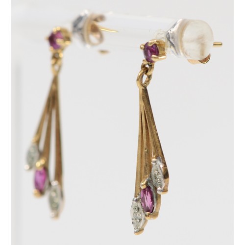 363 - A pair of 9ct gold ruby and diamond drop earrings with scroll backs, 25mm drop, 1.3g