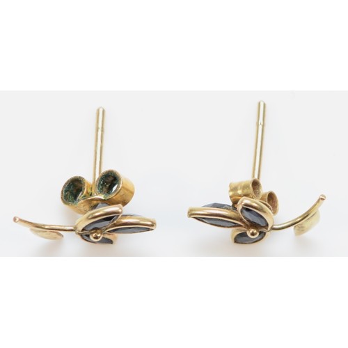 364 - A pair of 9ct gold marquise cut sapphire floral stud earrings, with scroll backs, bezel set, 0.6g