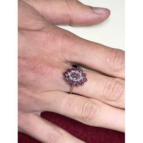 123 - A 9ct gold ruby and diamond cluster ring, M 1/2, 2.3g