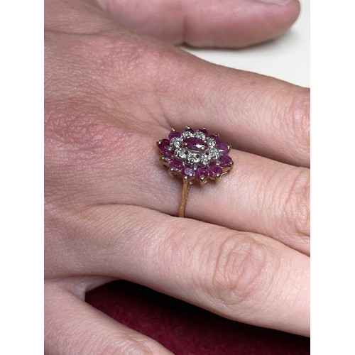 123 - A 9ct gold ruby and diamond cluster ring, M 1/2, 2.3g