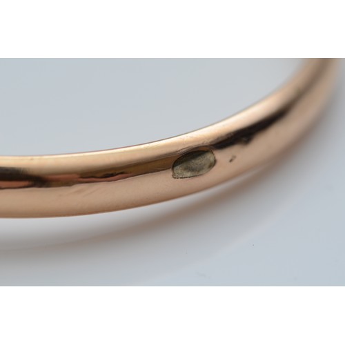 140 - A Victorian 15ct gold and half pearl hinged bangle, stamped 15ct, makers symbol, internal 58 x 50mm,... 