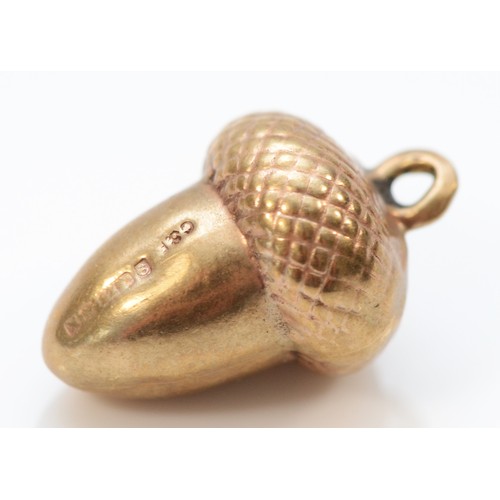 5 - A 9ct gold antique charm in the shape of an acorn, 15mm, 1g