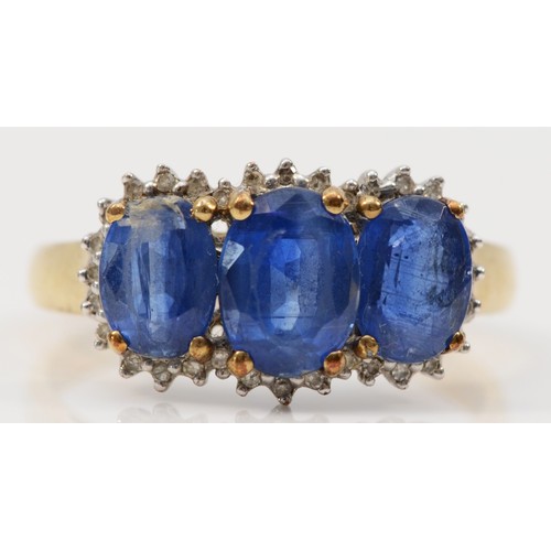 11 - A 9ct gold oval cut blue gemstone and diamond dress ring, claw set, S, 3.1g