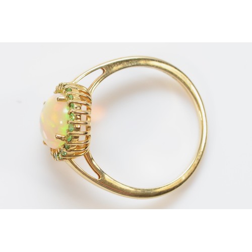 30 - A 9ct gold opal and green gemstone dress ring, N 1/2, 2.6g