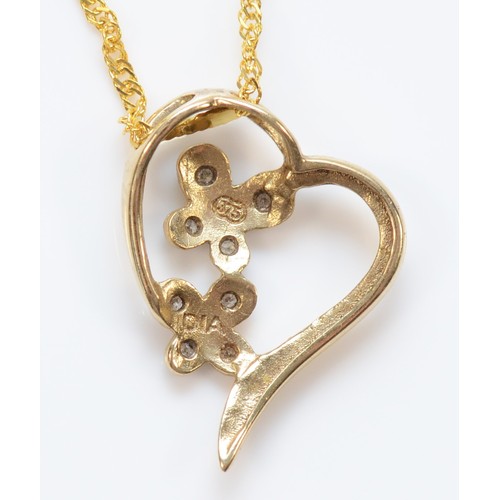 44 - A 9ct gold diamond floral heart shaped pendant with necklace, 17mm drop, 1.9g