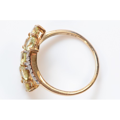 58 - A 9ct gold green gemstone and diamond dress ring, N 1/2, 2.4g