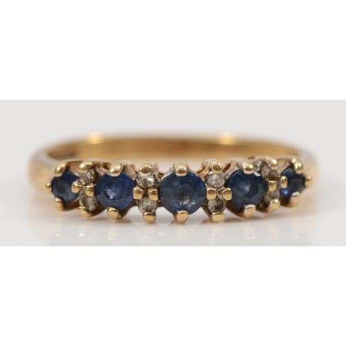 66 - A 9ct gold diamond accented sapphire set eternity ring, L, 1.9g