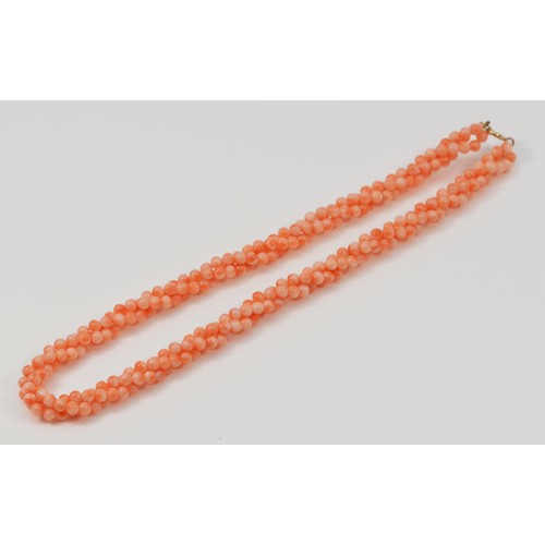 82 - A 9ct gold coral necklace, 34.6g