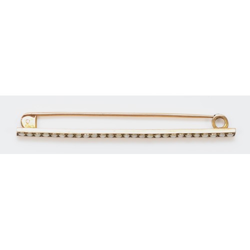 101 - A 9ct gold antique seed pearl bar brooch, 60mm across, 3.7g