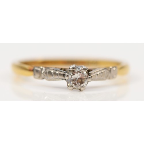 107 - An 18ct gold and platinum diamond set solitaire ring, N, 2.1g