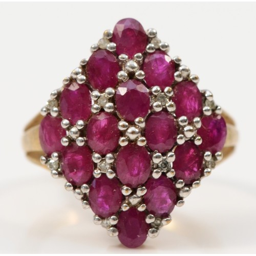 117 - A 9ct gold ruby and diamond dress ring, claw set, N, 4.8g