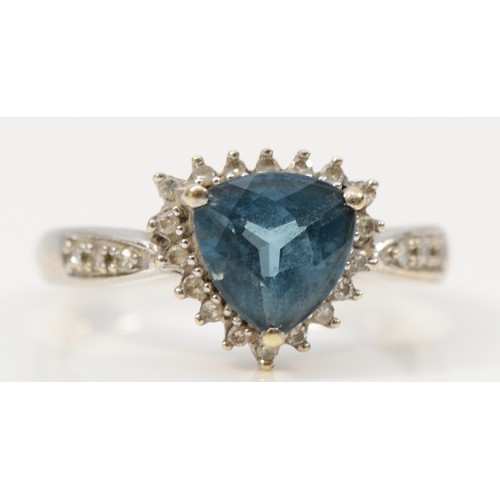 121 - A 9ct gold trillion cut blue gemstone and diamond dress ring, P, 3.2g