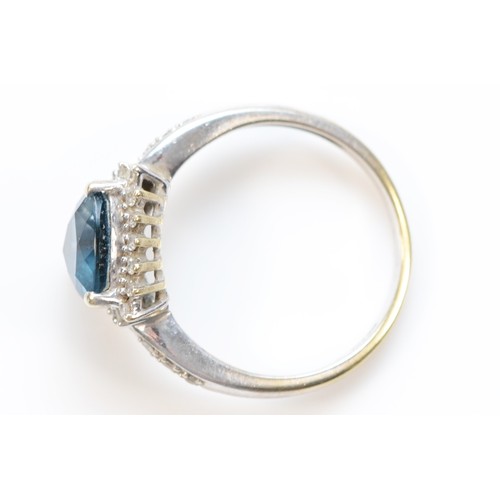 121 - A 9ct gold trillion cut blue gemstone and diamond dress ring, P, 3.2g