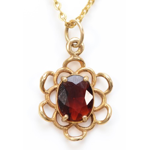 131 - A 9ct gold oval cut garnet pendant with necklace, 15mm diameter, 2.3g