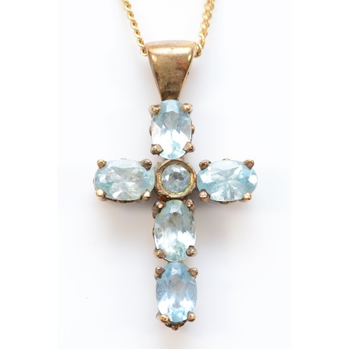 132 - A 9ct gold vari-cut blue gemstone cross pendant with necklace, 23mm cross, 4.5g